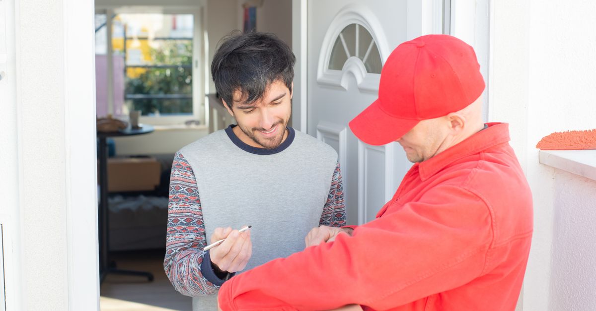 locksmith unlocking front door — Millburn Locksmith Inc